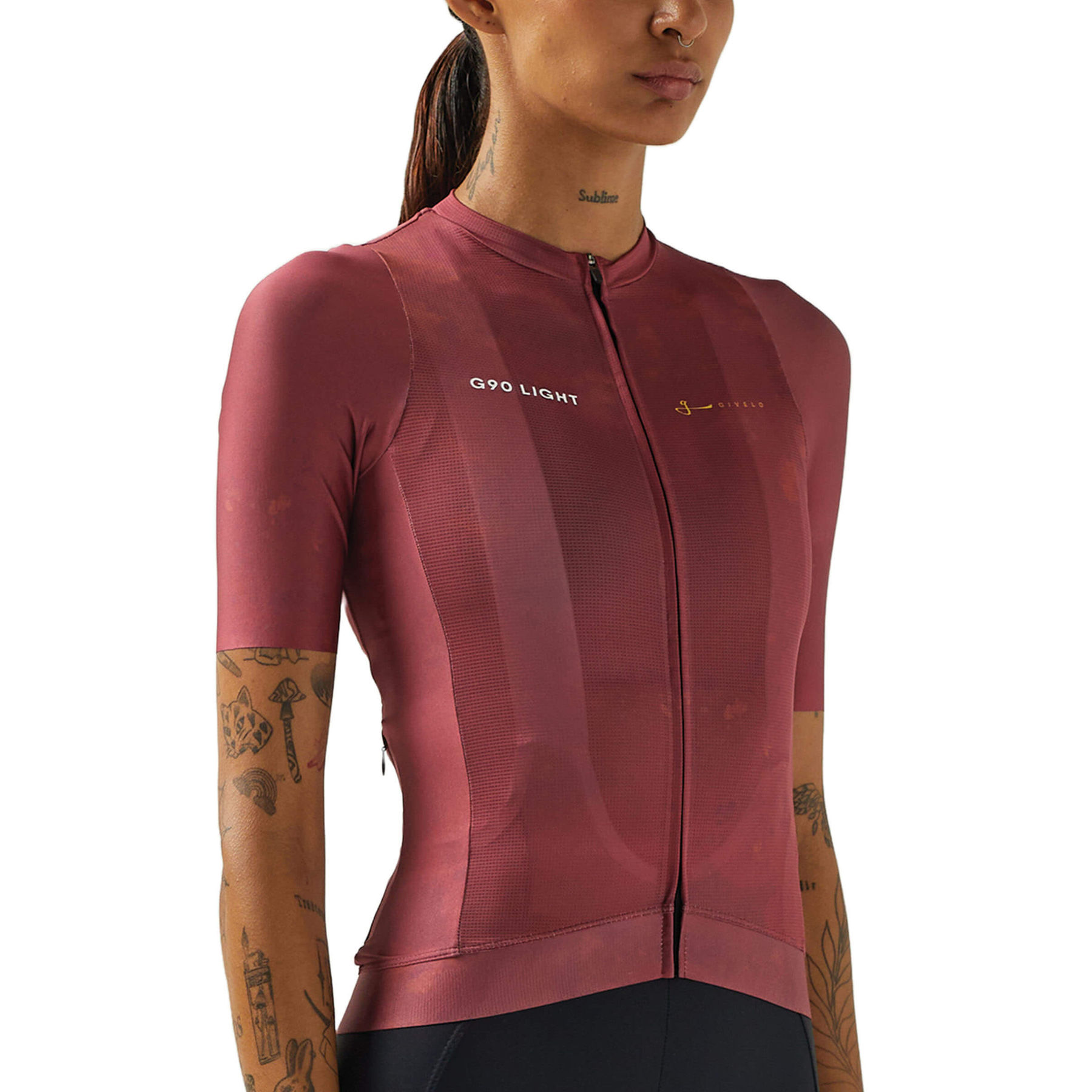 Female cyclist in a mauve Givelo G90 jersey, blending function with innovative design.