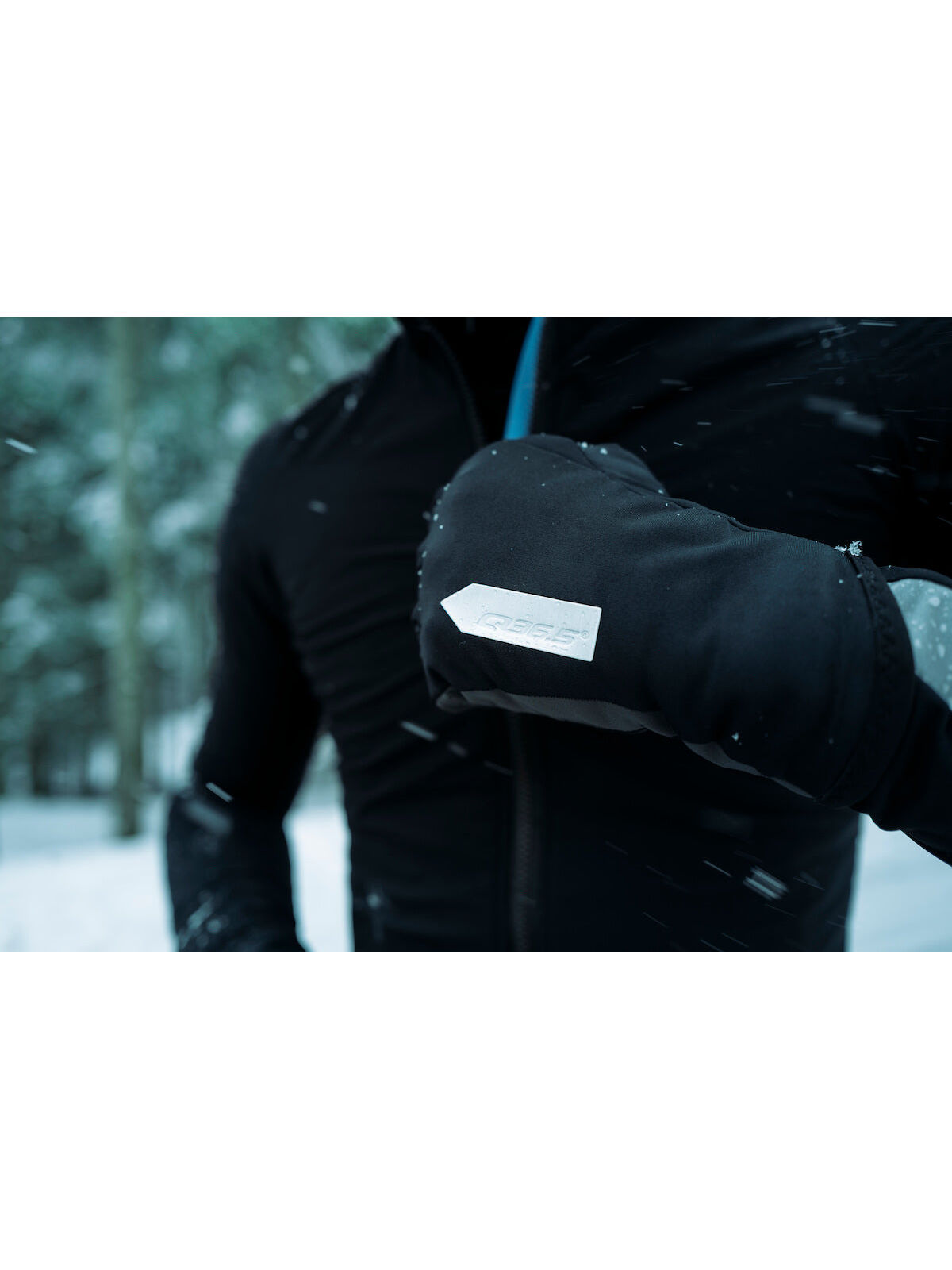 Close-up of a cyclist's hand showing the grip and fabric detail of  Q36.5's black winter glove.
