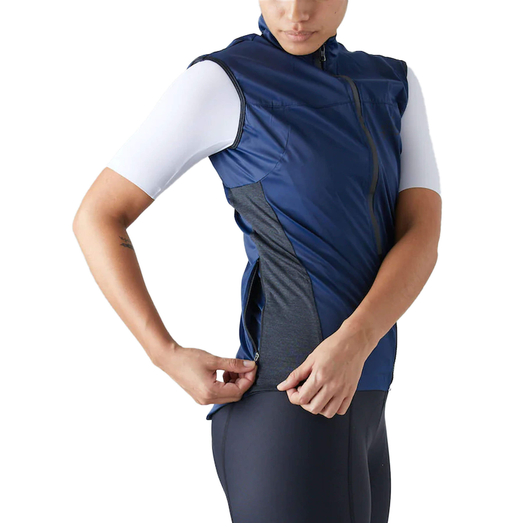 Side view of a blue Givelo Quick-Free Gilet on a cyclist, highlighting the easy pull-off design.
