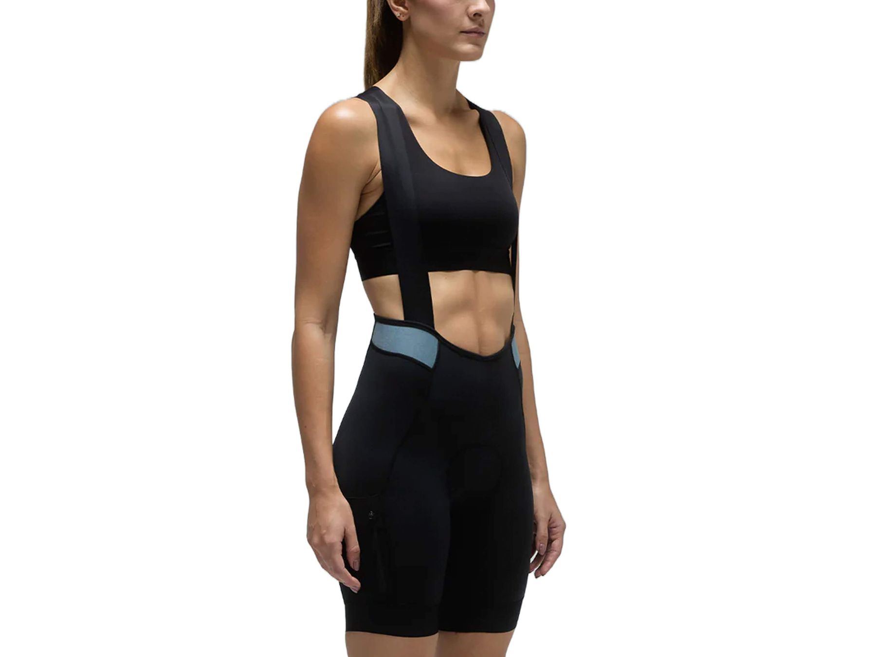 Woman in black Givelo MC Cargo Bib Shorts with blue accents, designed for cycling comfort.